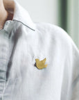 Fog Linen Work Bird Brass Brooch Cuckoo - model shown wearing product on shirt