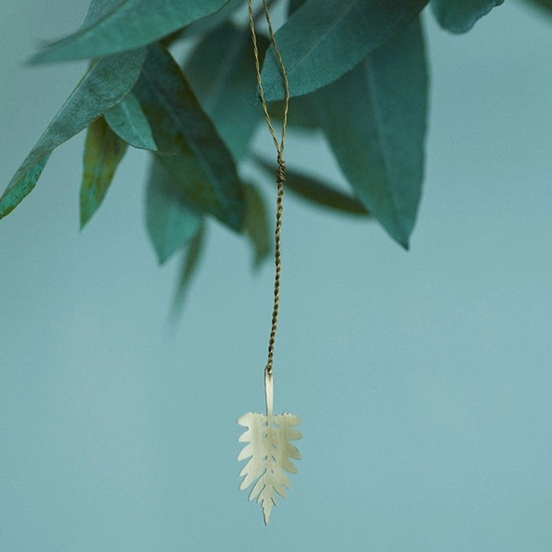 Fog Linen Work Brass Leaf - H - product shown hanging from plant