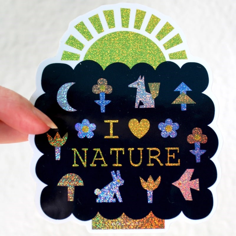 Leah Duncan I Love Nature Glitter Vinyl Sticker - model shown holding product