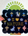 Leah Duncan I Love Nature Glitter Vinyl Sticker - model shown holding product