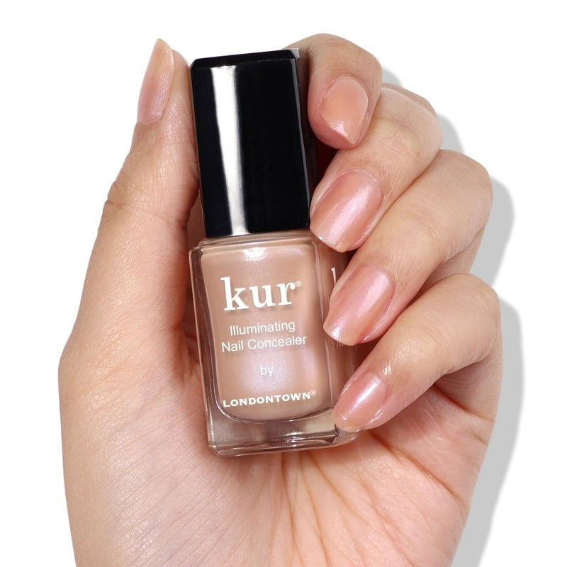 Londontown Illuminating Nail Concealer - Bare - model shown holding product