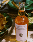 Flamingo Estate Organics Winter Harvest Persimmon Vinegar - product shown next to bowls of food