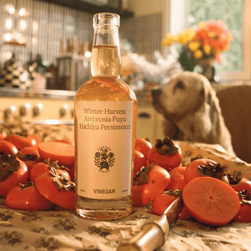 Flamingo Estate Organics Winter Harvest Persimmon Vinegar - product shown next to persimmons 