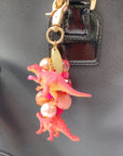 Lenora Dame Favorite Dinosaur Purse Charm in Taffy Pink - product shown attached to purse