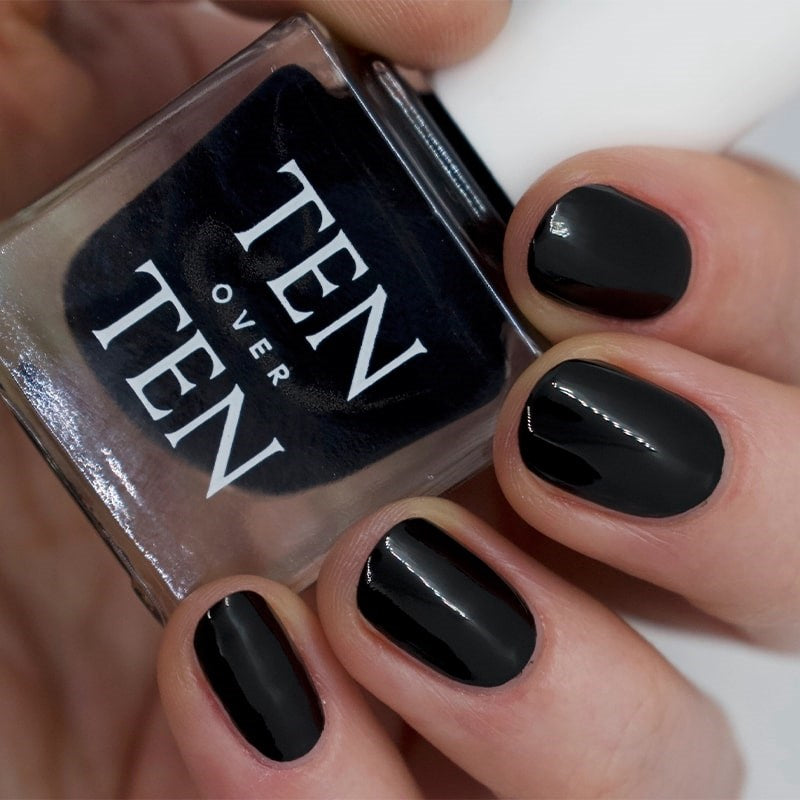 Tenoverten Nail Polish - Bond - model shown holding product with product on fingernails