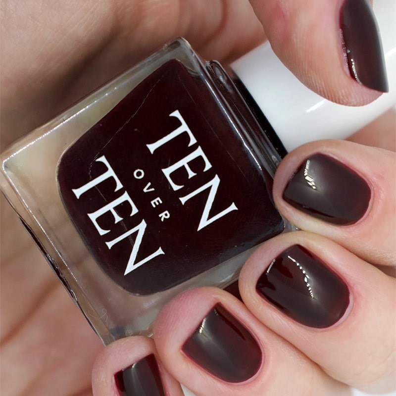 Tenoverten Nail Polish - Church - model shown holding product with product on fingernails