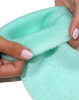 Londontown Pedi Perfect Moisturizing Spa Socks - model shown folding product inside out slightly