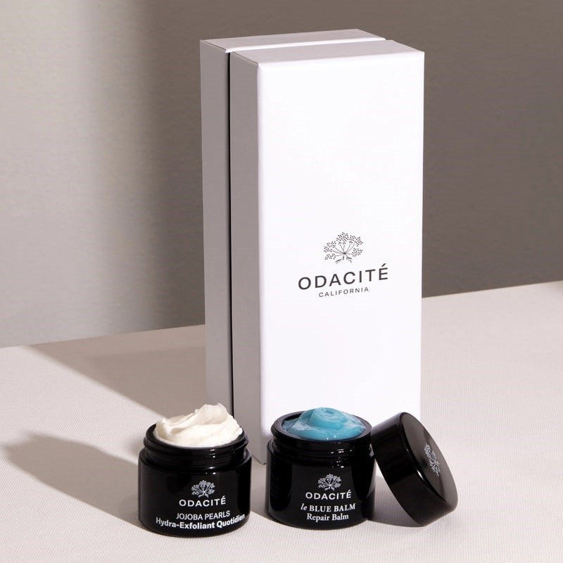 Odacite Smooth + Soothe Duo - open product containers next to product packaging