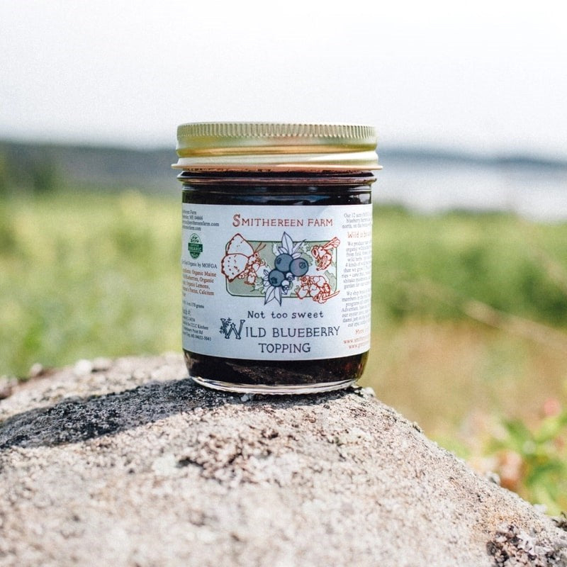 Smithereen Farm Organic Wild Blueberry Topping - product shown on rock in nature