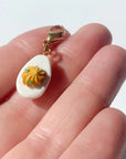 Bold Blossom Shop Deviled Egg Bag Charm - model shown holding product