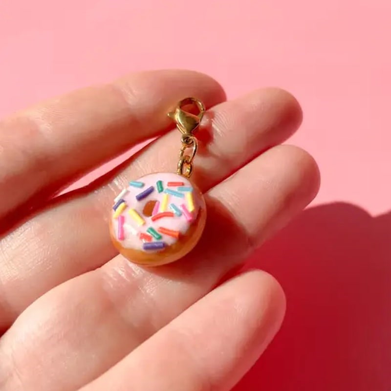 Bold Blossom Shop Donut Bag Charm - model shown holding product