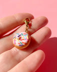 Bold Blossom Shop Donut Bag Charm - model shown holding product