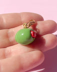 Bold Blossom Shop Olive Bag Charm - model shown holding product