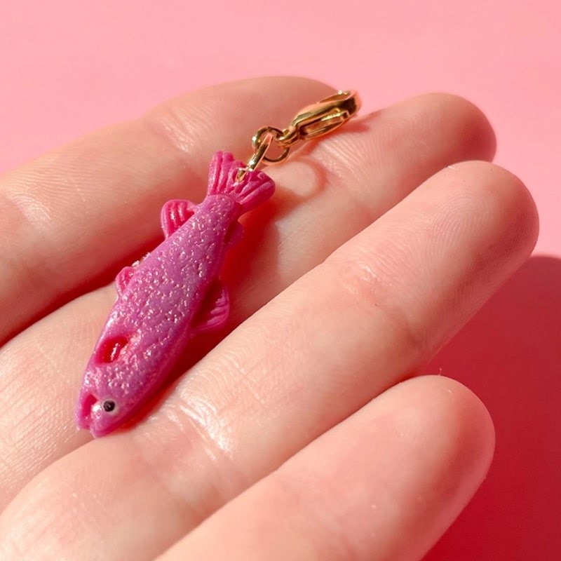 Bold Blossom Shop Pink Fancy Fish Bag Charm - model shown holding product