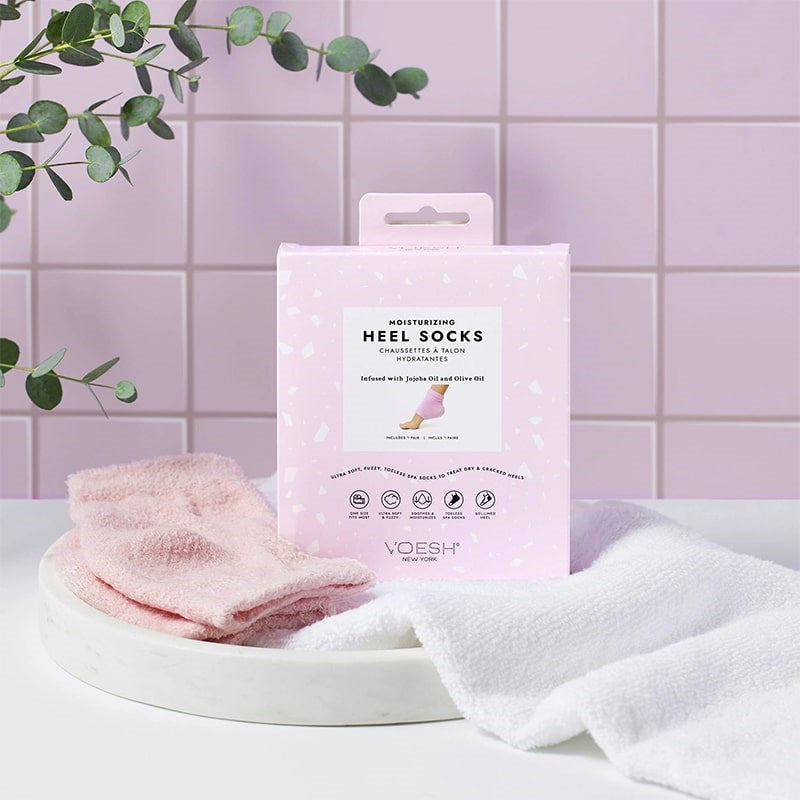 VOESH New York Moisturizing Heel Socks - Pink - products shown next to packaging and towel