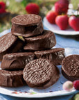 Wooden Table Baking Company Chocolate Covered Alfajores Cookies - multiple products shown on plate with strawberries