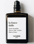 Versatile Paris La Foncedalle  Extrait De Parfum (15 ml) shown with cap off to feature the rollerball