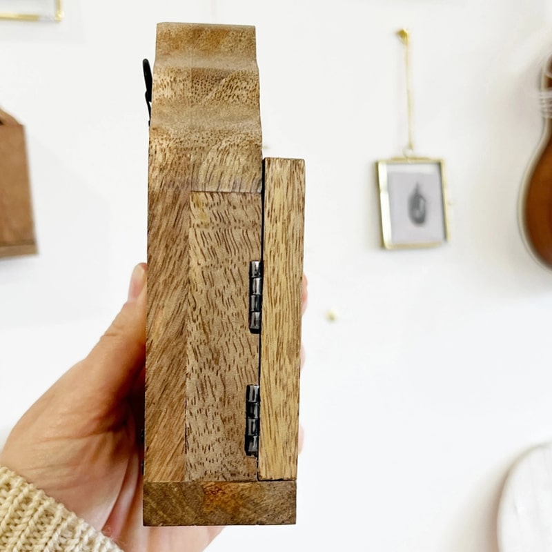 The Little Press Wooden Sanctuary with Doors and Mirror - model shown holding product at an angle