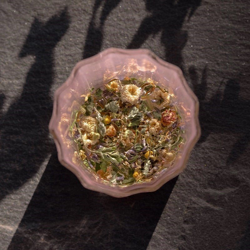 Leaves and Flowers Sleep Loose Leaf Tea - product shown inside glass with water