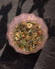 Leaves and Flowers Sleep Loose Leaf Tea - product shown inside glass with water