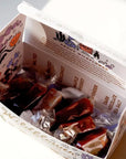 Wildflower Caramel Co. Assorted Caramel Flavors (6 pcs) showing individually wrapped caramels inside opened box