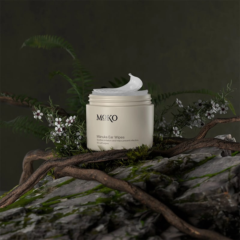 Moko Manuka Ear Wipes - product shown opened on rock with plants