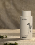 Moko Manuka Dog Wash - product shown on stone with moss