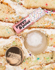 Poppy & Pout Lip Care Duo Birthday Confetti Cake - products shown on top of cake