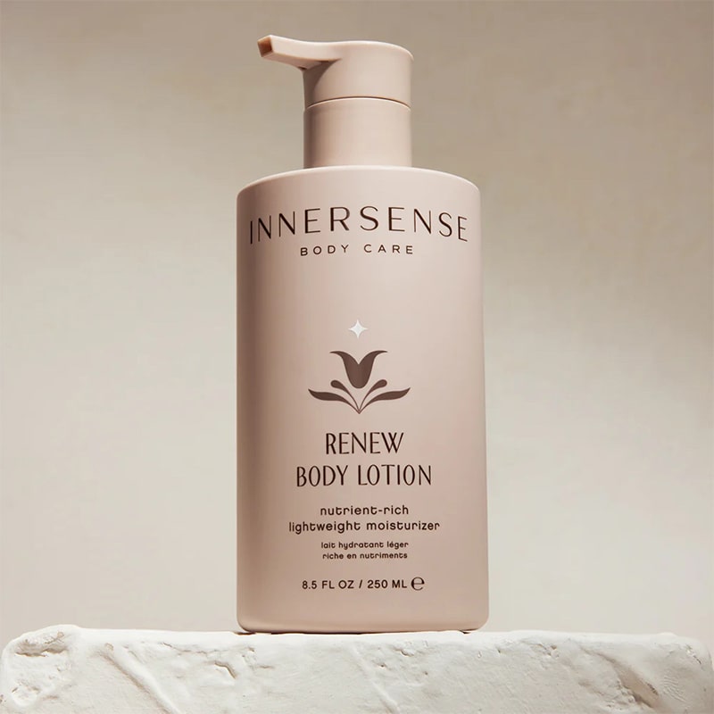 Innersense Organic Beauty Renew Body Lotion - product shown of stone block