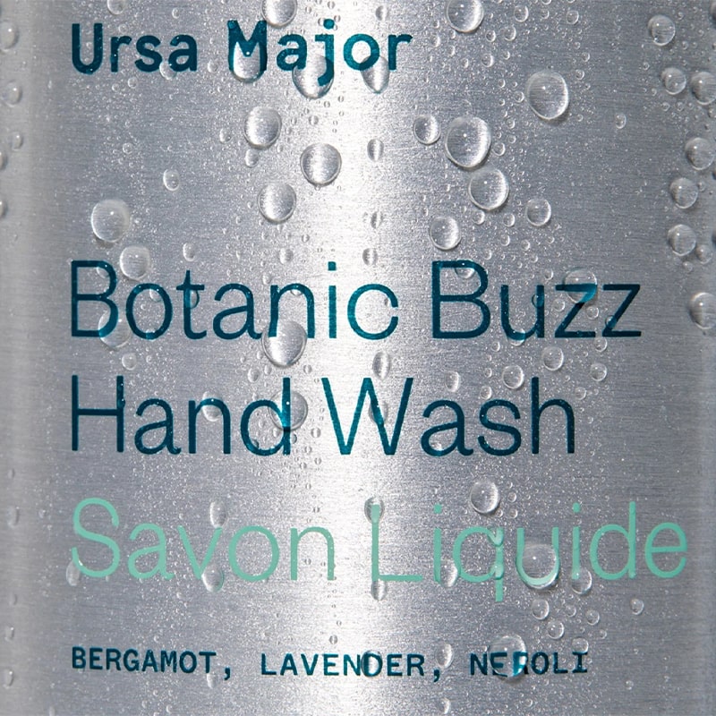 Ursa Major Botanic Buzz Hand Wash - close up of product label with water drops