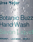 Ursa Major Botanic Buzz Hand Wash - close up of product label with water drops