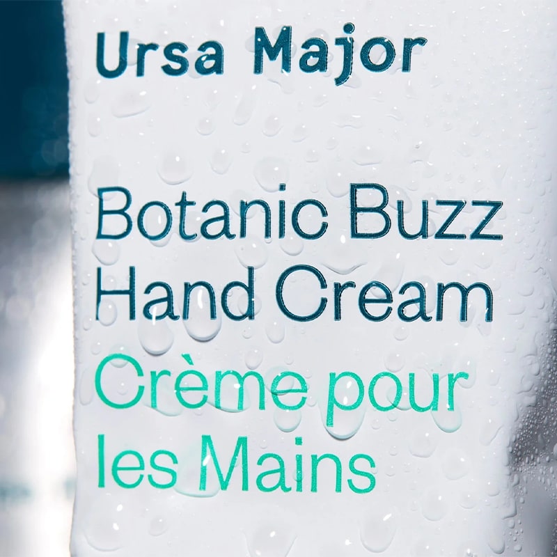 Ursa Major Botanic Buzz Hand Cream - close up of product label with water drops