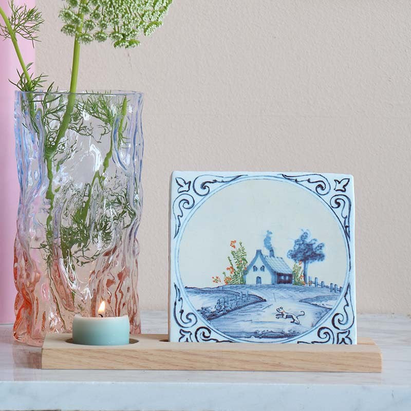 StoryTiles Small Tile - Our House Is A Very Very Fine House - product next to lit candle and glass vase with flower