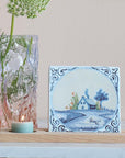 StoryTiles Small Tile - Our House Is A Very Very Fine House - product next to lit candle and glass vase with flower