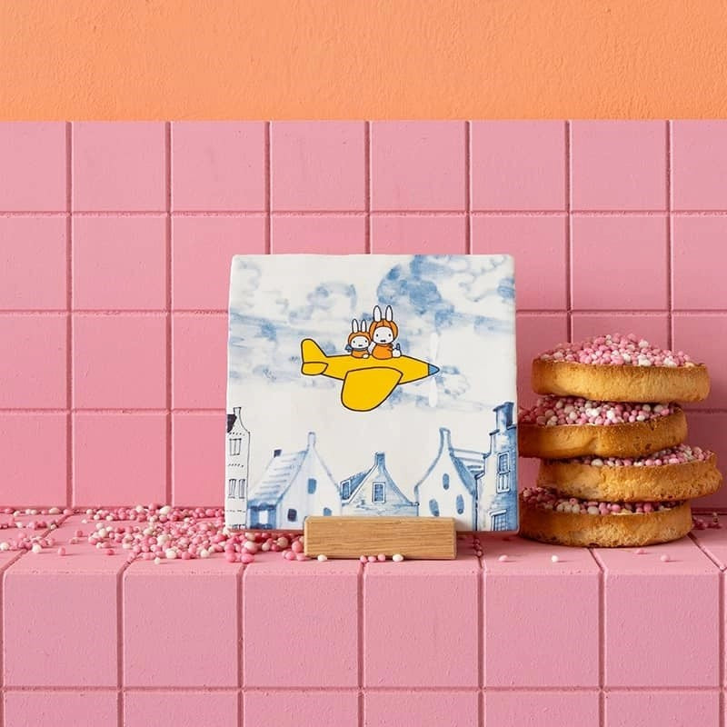 StoryTiles Small Tile - Miffy's Journey - product shown on pink bricks next to pastries