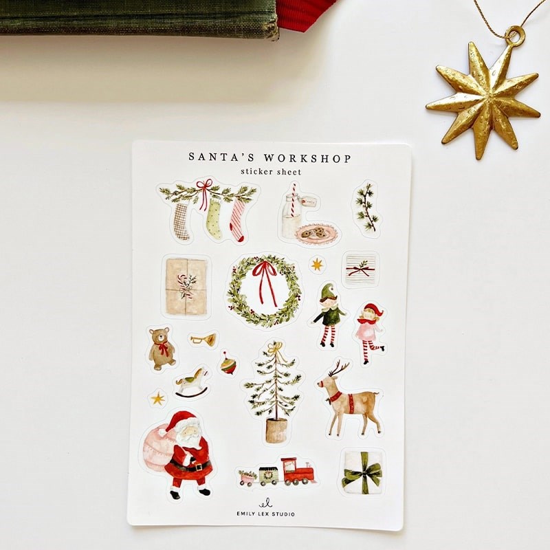 Emily Lex Studio Santa's Workshop Sticker Sheets - products shown next to napkins and star