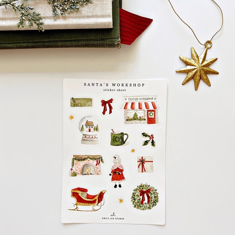 Emily Lex Studio Santa's Workshop Sticker Sheets - product shown next to star and books