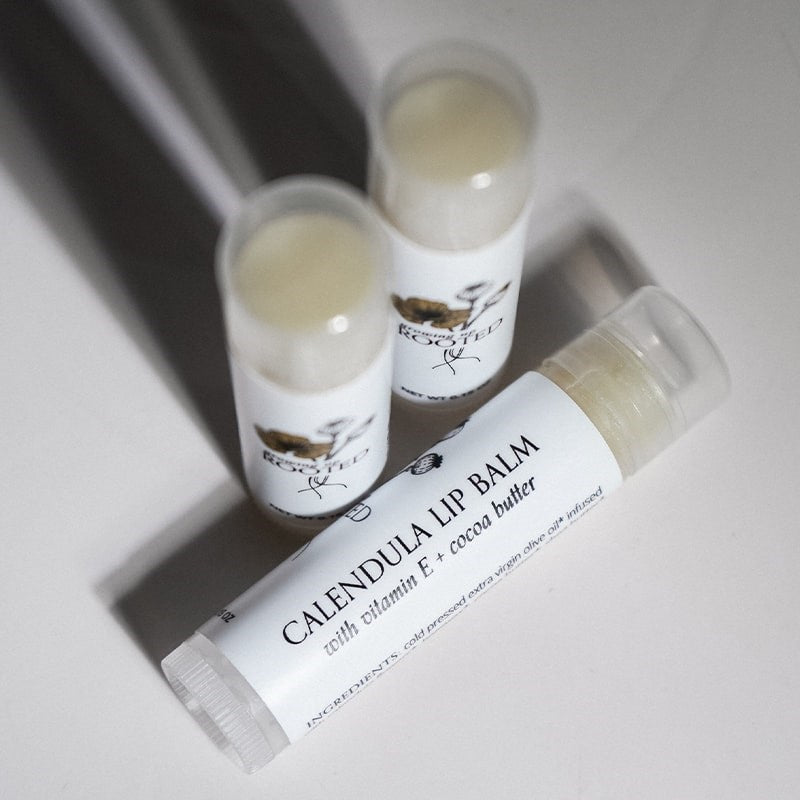 Growing Up Rooted Calendula Lip Balm - three products shown next to each other