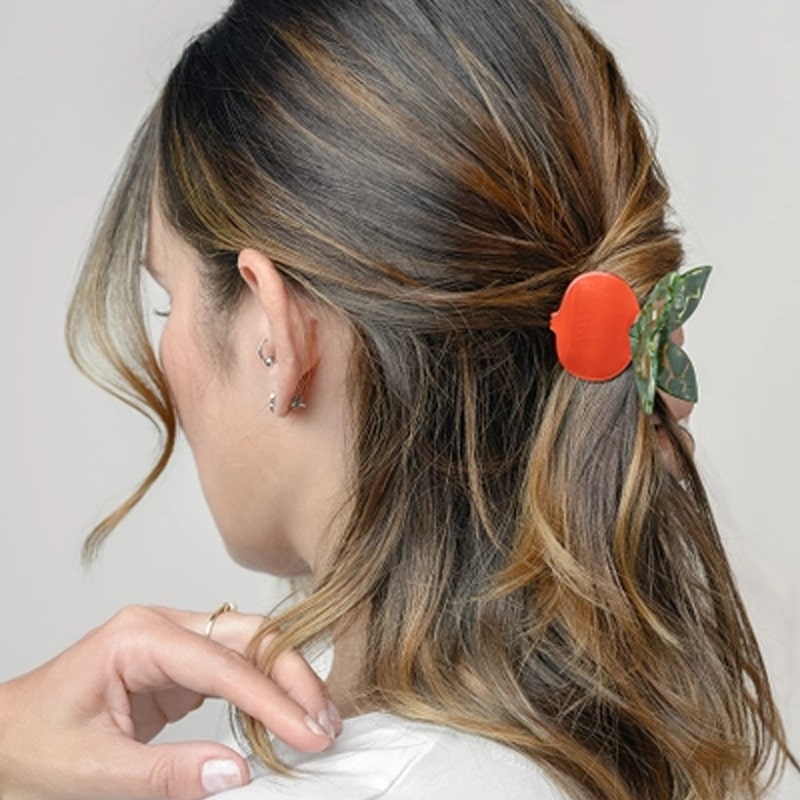 Model wearing Winona Irene Red Pomegranate Claw (1 pc) in hair