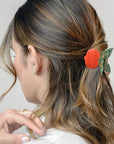 Model wearing Winona Irene Red Pomegranate Claw (1 pc) in hair