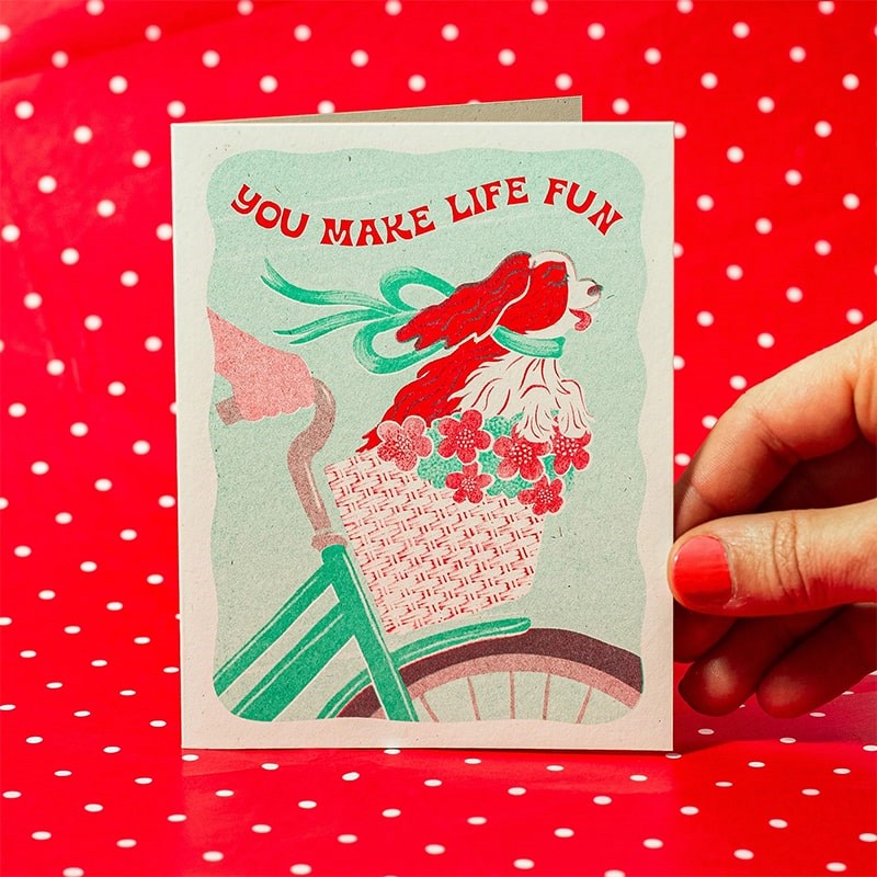 Lifestyle shot of Bromstad Printing Co. You Make Life Fun Dog Risograph Greeting Card (1 pc)