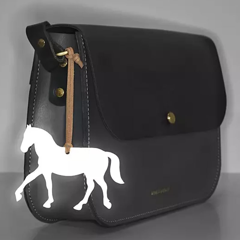 Firefly Reflectors Horse Reflex Deluxe - Dark Denim (1 pc) shown on handbag when dark to show horse reflecting