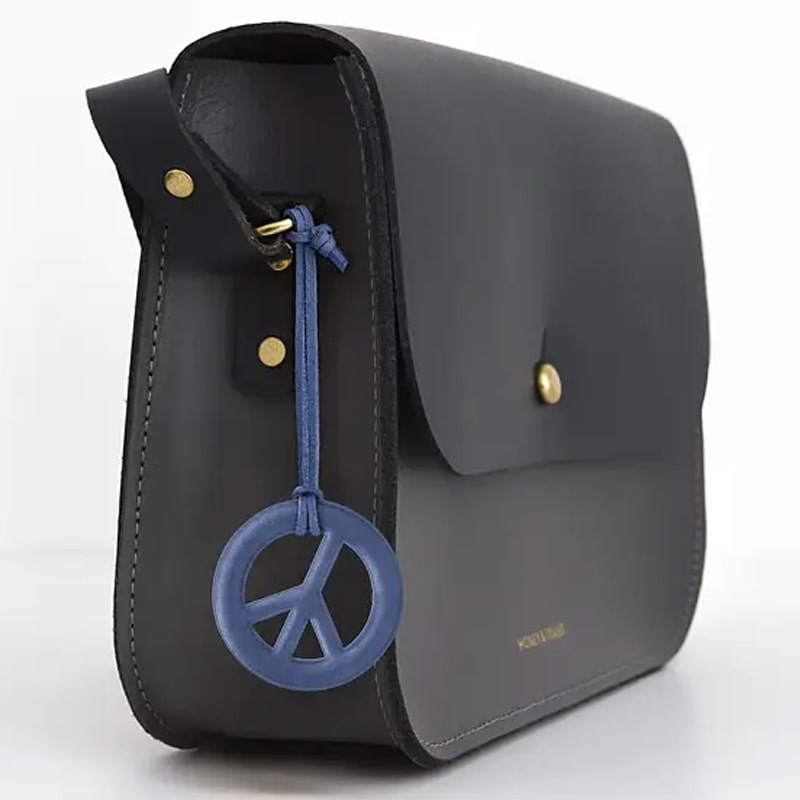 Firefly Reflectors Peace Sign Reflex Deluxe - Sky Blue (1 pc) shown on handbag