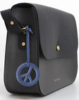 Firefly Reflectors Peace Sign Reflex Deluxe - Sky Blue (1 pc) shown on handbag