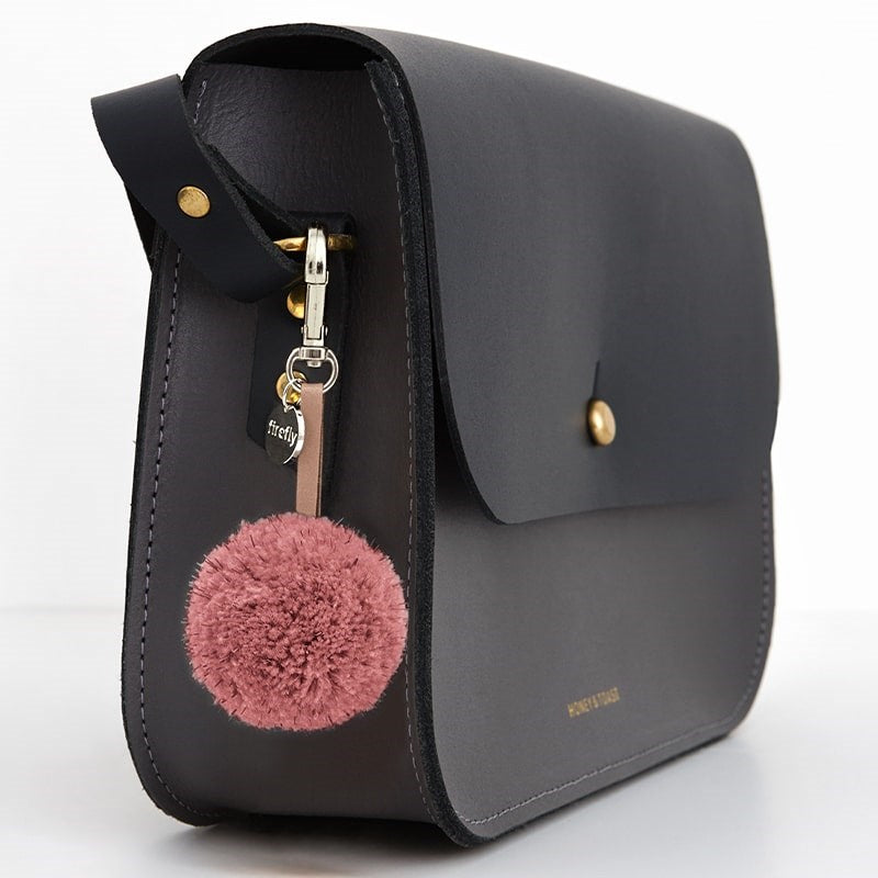 Firefly Reflectors Reflective Pom Pom - Rose - product shown on purse