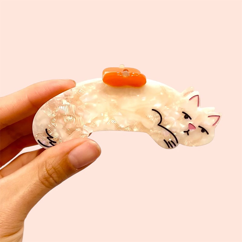 Carolyn Suzuki Goods Micio The Cat Hair Claw - model shown holding product