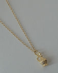 I Like It Here Club Chianti Charm - Gold - angled view of product on necklace