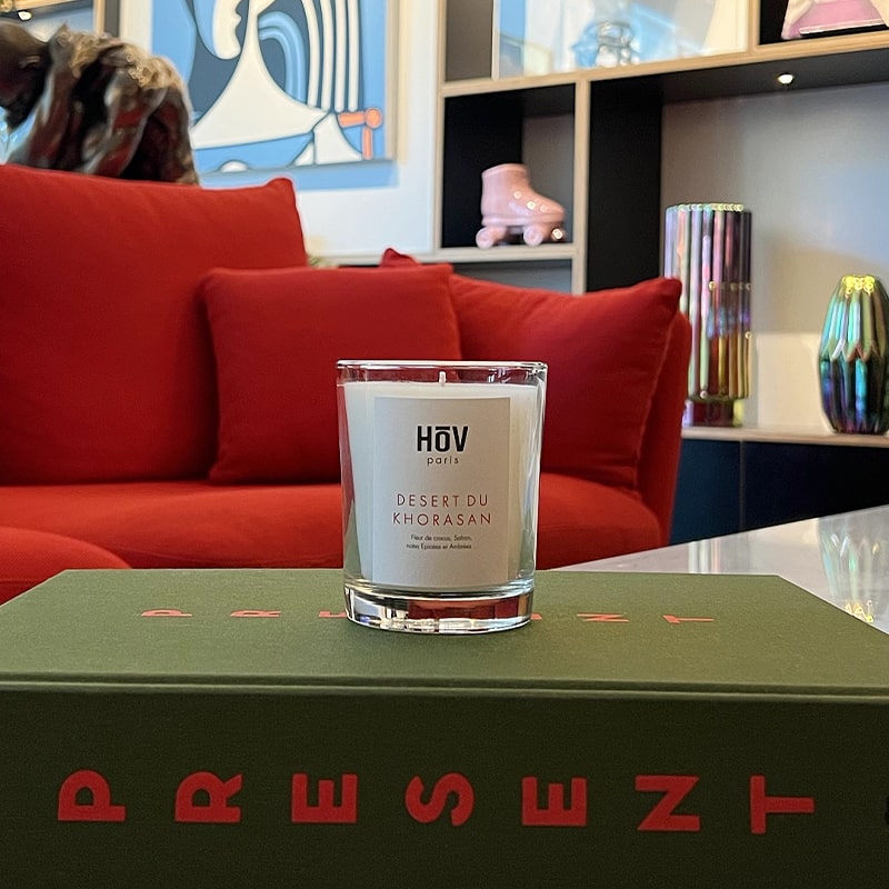 HoV Paris Scented Candle - Desert Du Khorasan (190 g) - product shown on book in living room