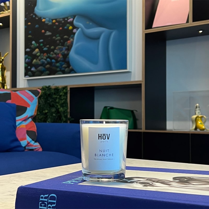 HoV Paris Scented Candle - Nuit Blanche (190 g) - product shown on book in living room