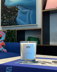 HoV Paris Scented Candle - Nuit Blanche (190 g) - product shown on book in living room